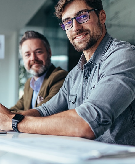Two men sitting at a desk